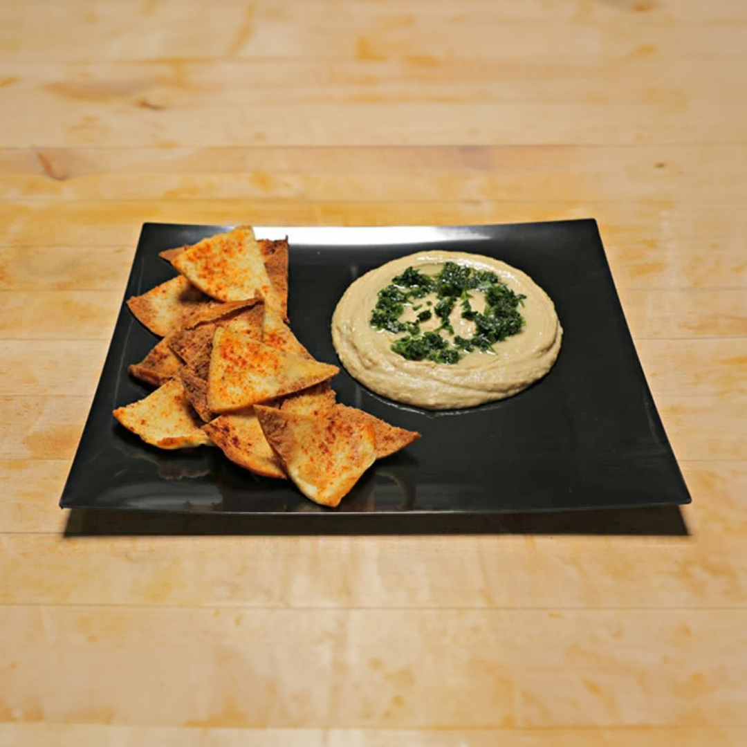 hummus_on_a_black_plate