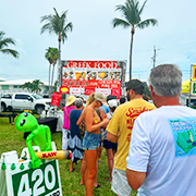 people in front of a food stand